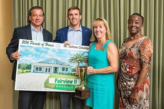 Emerald Homes' Fairview II was the Showcase Home winner. Above are Dennis Ginder, NEFBA President Chet Skinner, Mary Mansker and Maxine Levy.