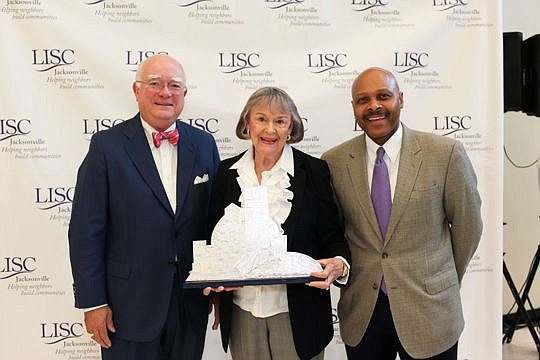 LISC Jacksonville board Chair J.F. Bryan, Delores Barr Weaver and LISC National President Maurice Jones.