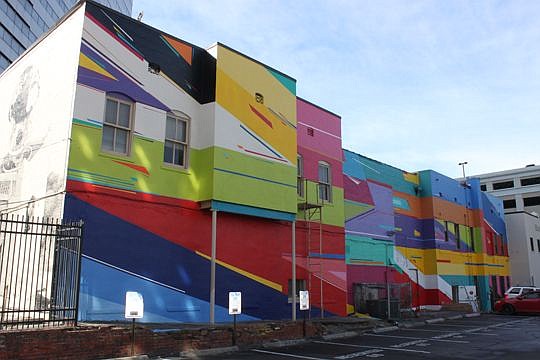 The back of the Atticus Bar, across from the Duval County Courthouse, received an infusion of color and style from artist Kenor recently as part of the Art (Re)Public project. Close to a dozen murals have sprung up from different artists throughout Do...