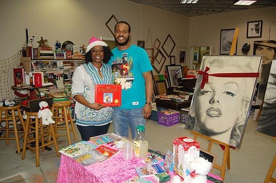 Husband and wife combine love for art and books at Jacksonville Land photo