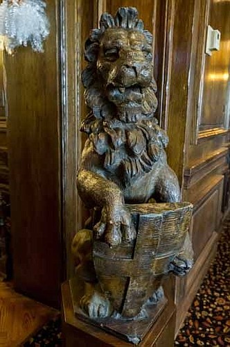 The first item that went on the auction block was one of the two lions that have sat outside the reception area of the club. It went for $800.