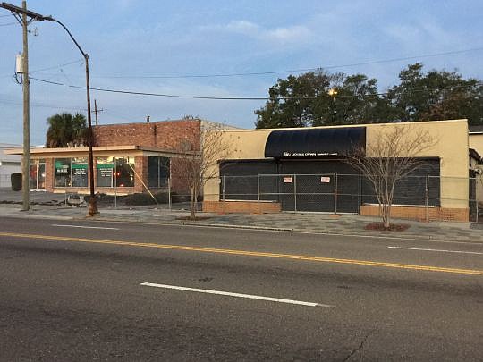 The former Two Doors Down restaurant and a building next to it are being demolished for construction of a Gate convenience store and gas station.