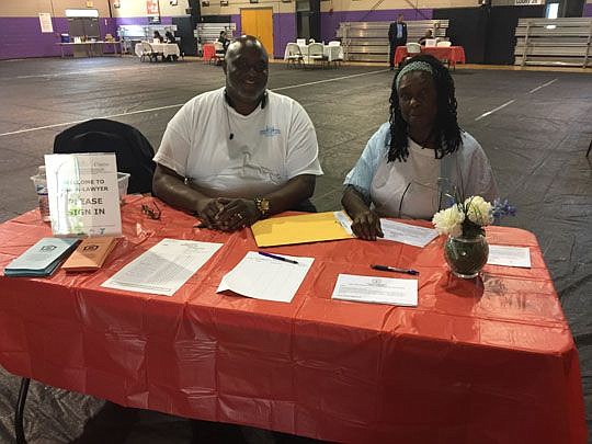 Brian Jones and Phyllis Maxwell greeted attendees Dec. 3 at Ask-A-Lawyer at the Johnson Family YMCA.