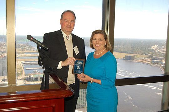 U.S. District Judge Timothy Corrigan presented on behalf of the Jacksonville chapter of the Federal Bar Association a special award to District Judge Marcia Morales Howard in recognition of her service to the community and to the court.