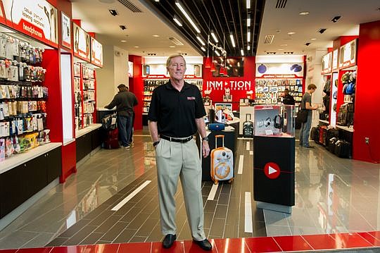 InMotion Entertainment Group President and CEO P. Jeremy Smith Jr. stands outside the company store on the main concourse at Jacksonville International Airport.