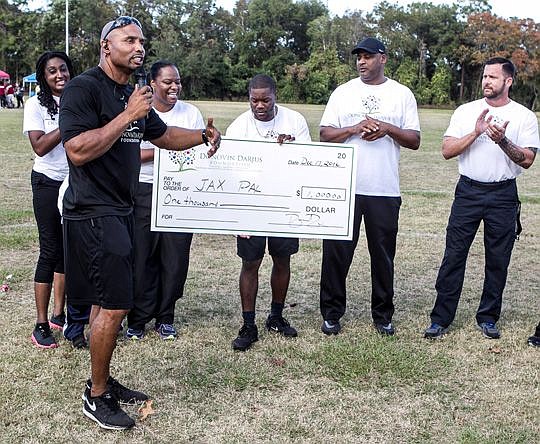 Retired Jacksonville Jaguars safety Donovin Darius and his namesake foundation partnered with EverBank Financial to host a Life Camp for Families at the Police Athletic League on Monument Road. More than 100 people participated in workshops focusing o...