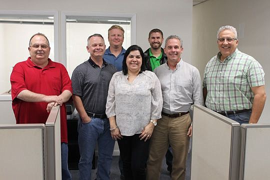 The Traxxall team led by Jeff Dougherty, second from left, and Dewayne James, right. The Montreal-based company recently opened its first U.S. office in Orange Park because of an increase in aircraft business and the local talent base.