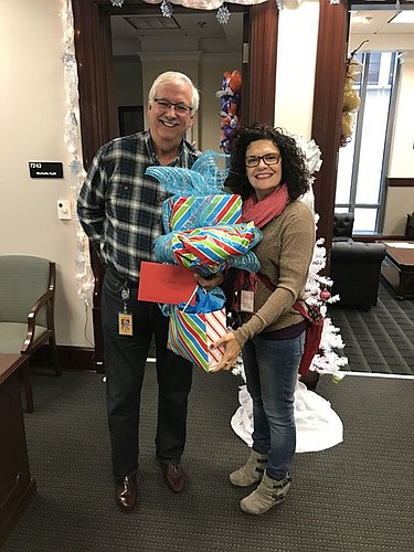 Duval County Judges Roberto Arias and Eleni Derke donated gifts to The Jacksonville Bar Association's annual holiday project for seniors.
