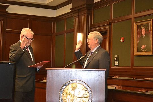 4th Judicial Circuit Chief Judge Mark Mahon administers the oath of office to Public Defender Charlie Cofer, who assumed office Tuesday. He defeated former Public Defender Matt Shirk in the primary, then a write-in candidate in the general election.