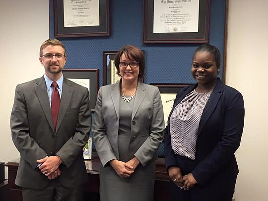 From left, 3rd Judicial Circuit Judge Wesley Douglas (Florida Coastal School of Law 2004), Coastal Law professor Natalie Tuttle and Johneshia Brown, an assistant state attorney in Pensacola and a 2016 Florida Coastal graduate, volunteer at the school'...