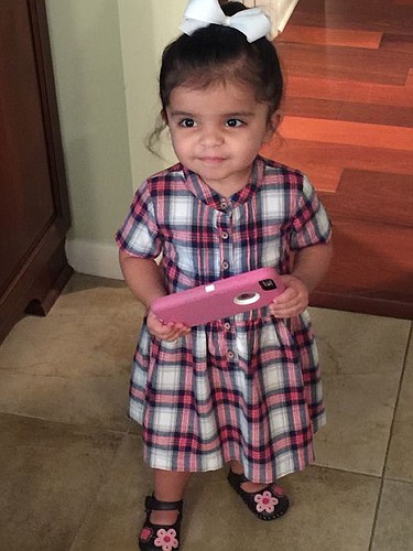 Not even 2 years old, Salem Ahmed knows her way around an iPhone.