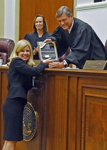 Fourth Judicial Circuit Judge Virginia Norton accepts the Distinguished Judicial Service Award from Florida Supreme Court Chief Justice Jorge Labarga. The honor was among several given out during The Florida Bar's Pro Bono Service Awards ceremony Thur...