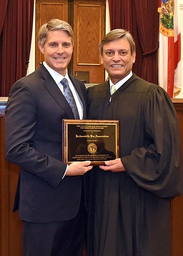 The Jacksonville Bar Association President Geddes Anderson accepted the 2017 Voluntary Bar Association Pro Bono Award from Florida Supreme Court Chief Justice Jorge Labarga.
