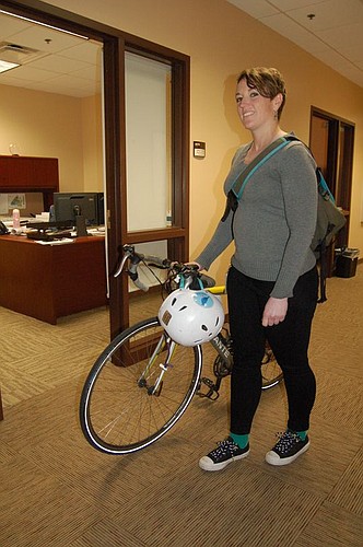 Amy Ingles, the city's bicycle and pedestrian coordinator, rides her bike each day from her home in Riverside to her office Downtown at the Ed Ball Building.