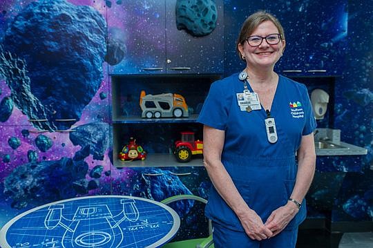 Pat Kirkland, Wolfson Children's Hospital manager of Family Support Services, is shown in a playroom decorated like a space ship, donated by former Jacksonville Jaguar Maurice Jones-Drew.