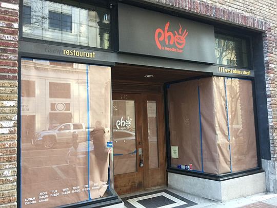 Window interiors are covered as the former Pho restaurant Downtown along Adams Street is renovated for Kazu Sushi Burrito.