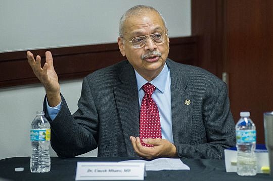 Dr. Umesh Mhatre discussed ways for attorneys to determine if their clients are mentally competent to stand trial during the event held in the jury room of the Duval County Courthouse.