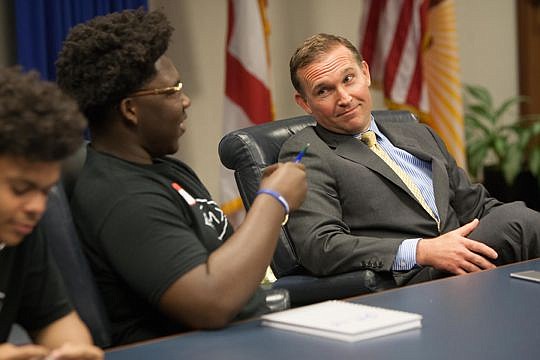 Mayor Lenny Curry had lunch with Robert E. Lee High School students who are members of the EVAC program. They talked about leadership, crime and a little football. Above, Chris Burgess asked Curry how many Jacksonville Jaguars games he has attended. T...