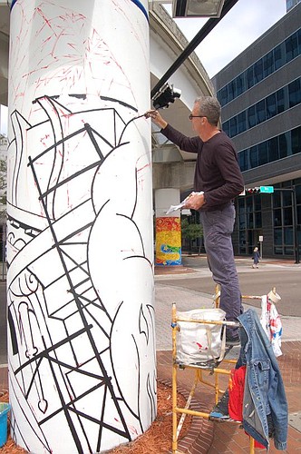 Miami-based artist and designer Andrew Reid Shed didn't let a stiff breeze on West Bay Street deter him from starting work on the first of eight Skyway track columns he's painting as part of the Downtown Investment Authority's Urban Arts Project in pa...