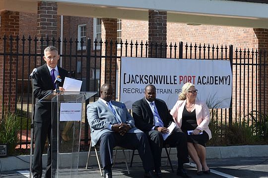 Operation New Hope founder and CEO Kevin Gay, at the podium, talks about the Jacksonville Port Academy, which his nonprofit launched Tuesday with JaxPort.