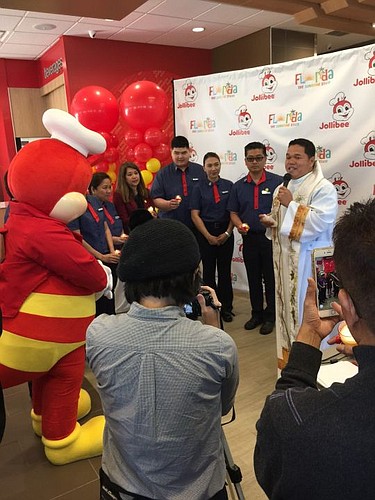 The Rev. Rafael Lavilla Jr., a priest with St. Paul's Catholic Church in Jacksonville Beach, gave the blessing Friday to open Jollibee.