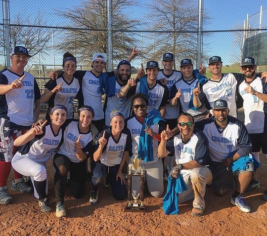 The Florida Coastal School of Law celebrates after winning the coed division of the  34th annual University of Virginia Law Softball Invitational.