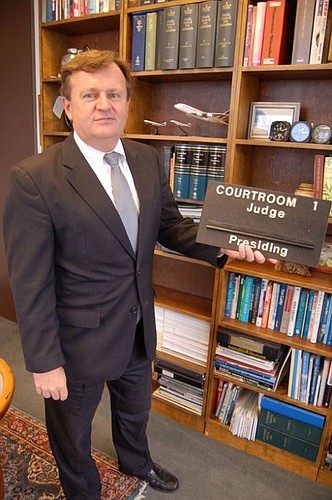 Attorney Ed Booth collects local historical artifacts, including the sign that identified Courtroom 1 in the now-abandoned former Duval County Courthouse on East Bay Street.