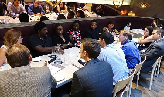 Incoming JAX Chamber Chair John Peyton, fourth from left,  hosts a Community Supper. More are planned in May.