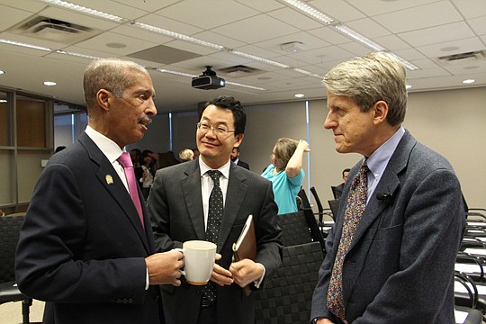 National Association of Realtors President William Brown, left, talks with NAR Chief Economist Lawrence Yun and Robert Shiller, a Nobel Prize-winning economist at the association's offices.