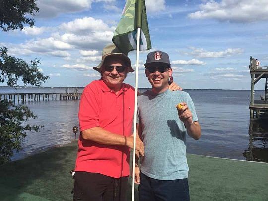 Attorney Steve Pajcic, left, with Thomas Lloyd, who sank a hole-in-one last year to win $6,000 and a matching donation for Jacksonville Area Legal Aid from The Law Firm of Pajcic &amp; Pajcic.