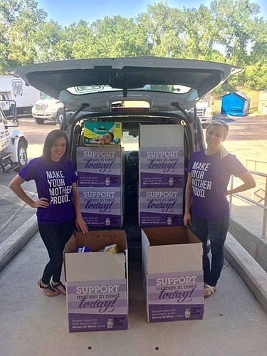 Danielle Gariepy, left, and Kristen Pageau from Two Men and a Truck show donated items delivered to the Betty Griffin Center in honor of Mother's Day.