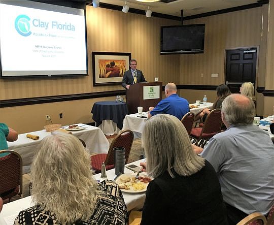 Bill Garrison, president of Clay Florida Economic Development Corp., presents an update Wednesday on the agency's work. The program was attended by about 120 members of the Northeast Florida Association of Realtors. Photo by Caren Burmeister