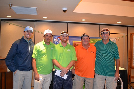 Chet Skinner, left, 2016 NEFBA president, congratulates the winning team in the Chester Stokes Holiday Golf Tournament from Greene's Quality Construction: Mike Greene, Jason Herndon, Donnie Thomas and Richard Gaines. Second place went to Eagle Roofing...