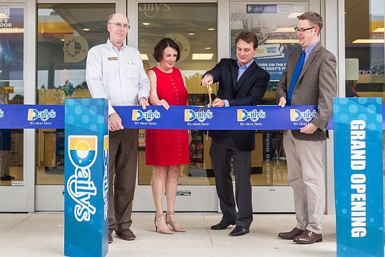 District 6 Jacksonville City Council member Matt Schellenberg, HabiJax CEO Mary Kay O'Rourke, Daily's President and CEO Aubrey Edge and Brett Hartley, principal of Crown Point Elementary School, cut the ceremonial ribbon to open the Daily's convenienc...