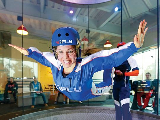 Giant fans that can blast winds up 175 mph create a cushion of air for indoor skydivers at iFLY.