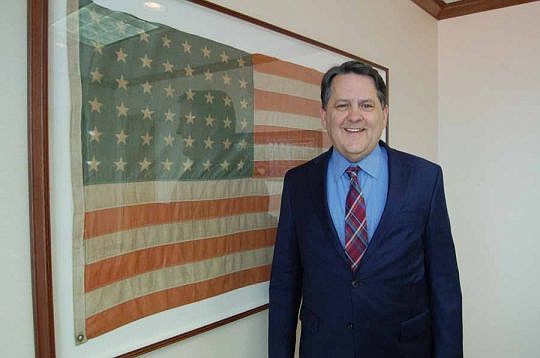 Attorney Charles McBurney served in the state House of Representatives from 2007-16 while also maintaining his law practice in Jacksonville. The American flag with 48 stars is a family heirloom displayed in McBurney's conference room.
