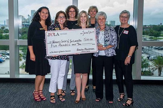 JWLA presented a $500 donation to the Women's Center of Jacksonville in honor of the association's 2017 Woman Lawyer of the Year SharÃ³n Simmons. From left, Sarah Mannion, Women's Center Executive Director Teresa Miles, Gillian Ticehurst, Amelia Hende...