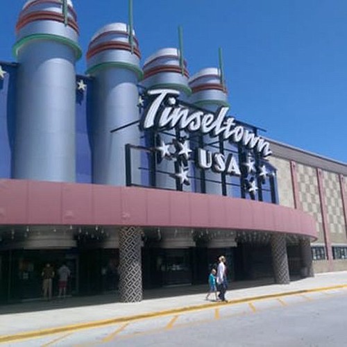 The city is reviewing a zoning exception for the Tinseltown theater to serve alcohol.