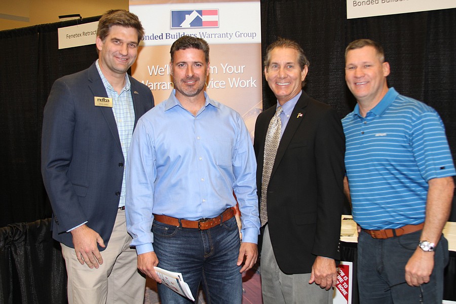 From left, Hans Krieg, Northeast Florida Builders Association member services director, meets with Michael BourrÃ©, president of BourrÃ© Construction Group; Doug Wenzel of Bonded Builders Warranty Group; and Andy Chambers, managing partner of MasterCr...