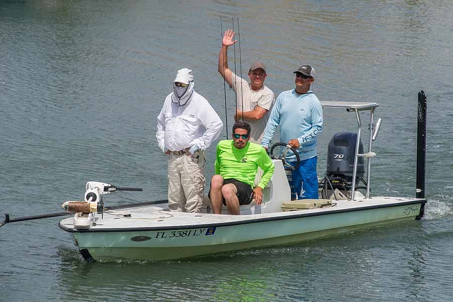 Lauren Smith, left, Brian Church, Clayton Farmer and Chris Herrera arrive with their catch.