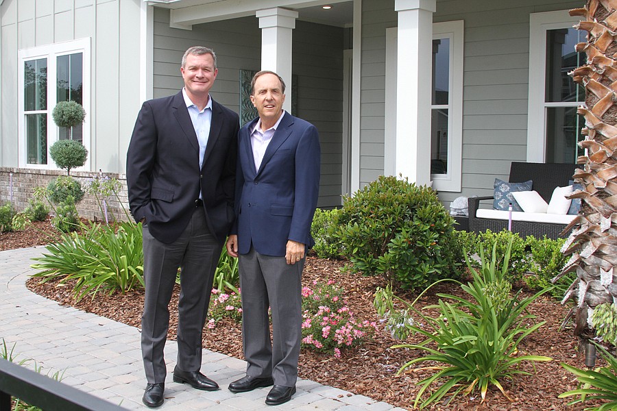 Providence Homes President and COO Sean Junker and CEO and founder Bill Cellar in front of a company model home in Nocatee. Providence is one of four builders in Nocatee's new Outlook at Twenty Mile neighborhood,