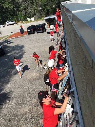 An army of red shirts can mean only one thing: Keller Williams is helping Renew, Energize and Donate to a worthwhile community effort.