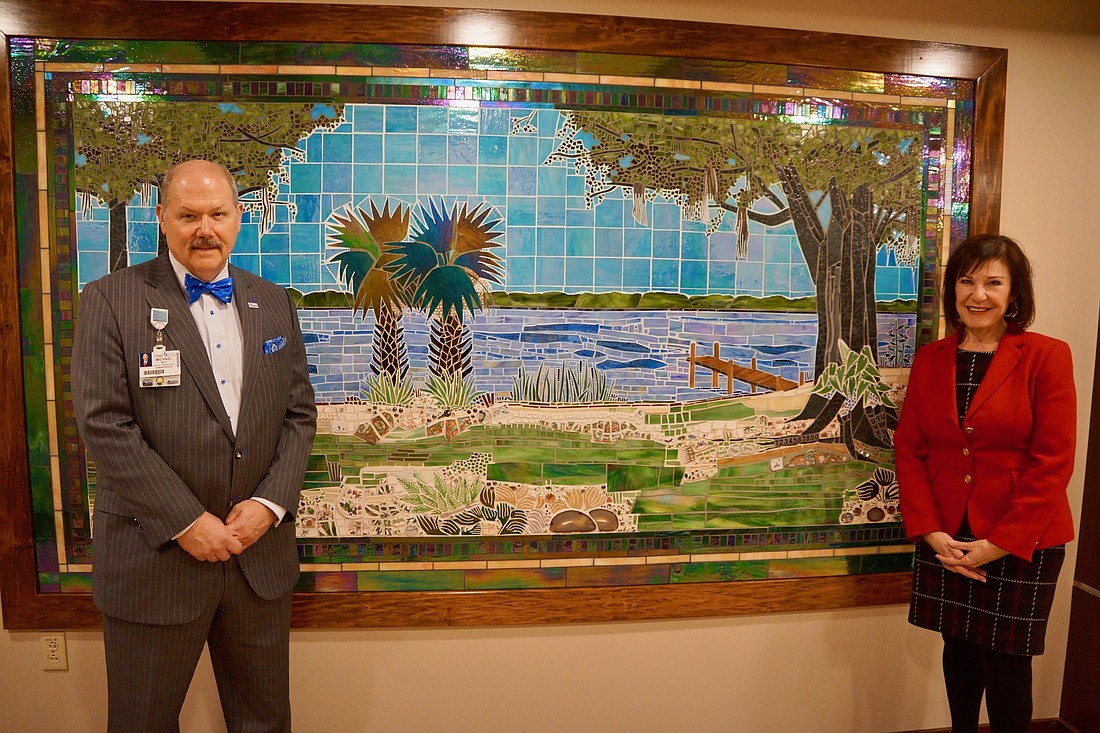 Michael Mayo, president of Baptist Medical Center Jacksonville, and Susan Ponder-Stansel, president and CEO of Community Hospice and Palliative Care.