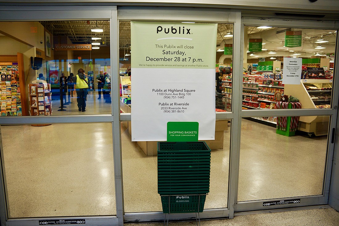 A sign on the door of the Publix at 5210 Norwood Ave. in Gateway Town Center informs customers that the store will close 7 p.m Dec, 28.