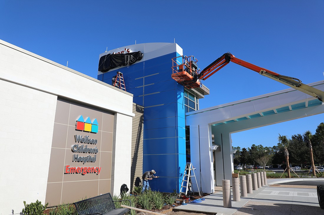Workers prepare the Wolfson Childrenâ€™s Hospital emergency room for its opening at Baptist South.