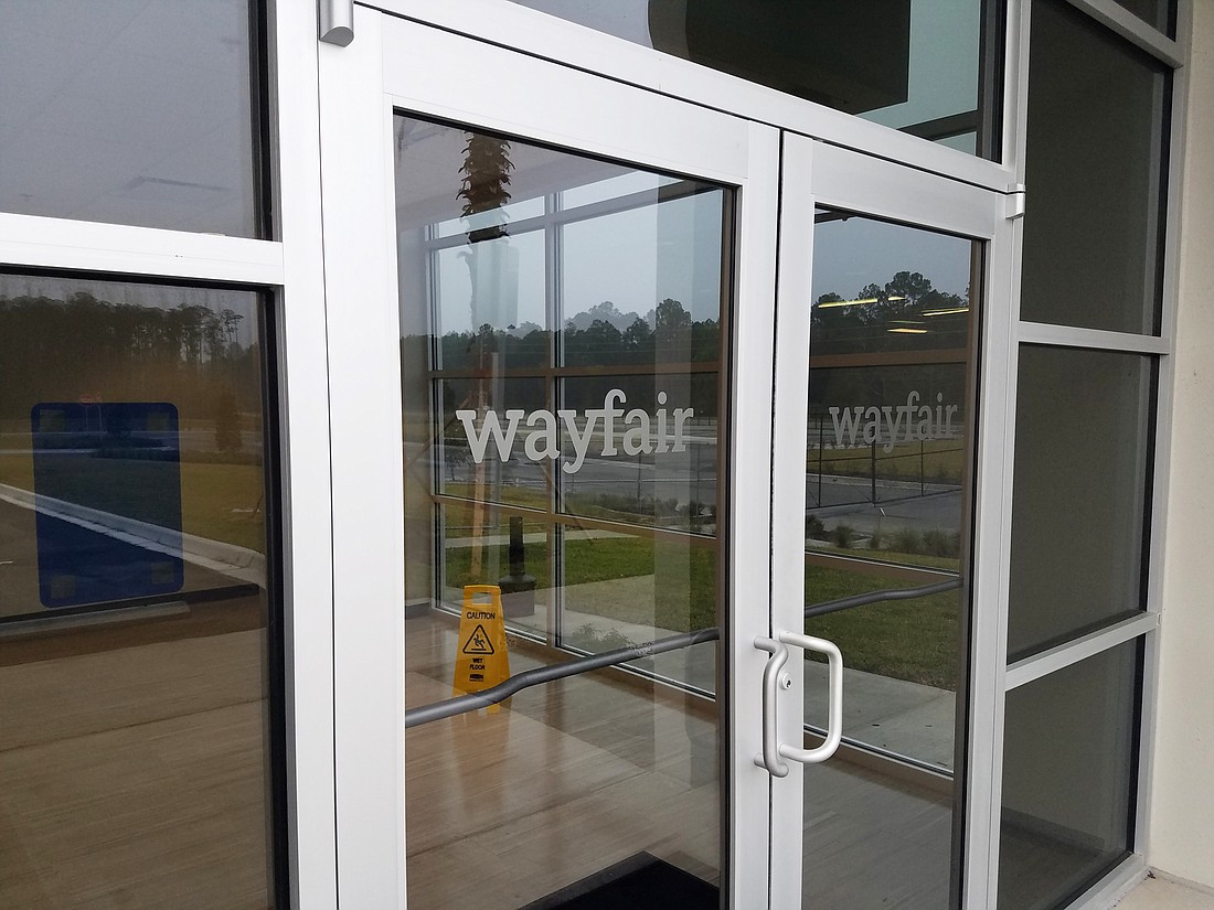 The entrance to the Wayfair building at 13483 103rd St.