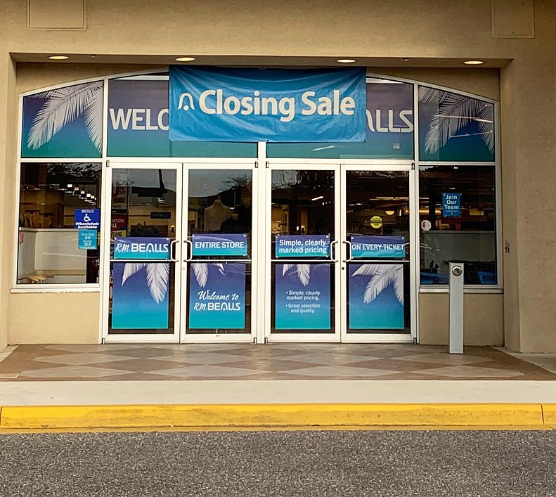 A closing sale sign is posted above the entrance to R.M. Bealls  at 860 Commerce Center Drive.