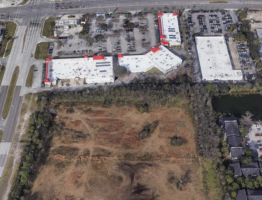 Subaru of Jacksonville owner Phil Porter wants a zoning exception on part of the vacant property that backs up to his dealership at the upper right.