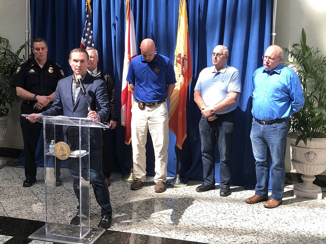Jacksonville Mayor Lenny Curry briefs reporters March 13 on his decision to indefinitely close all city-owned event venues due to the spread of coronavirus.