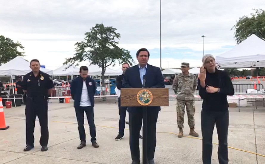 Florida Gov. Ron DeSantis holds a news conference April 10 at the COVID-19 drive-thru testing facility at Lot J in Downtown Jacksonville.